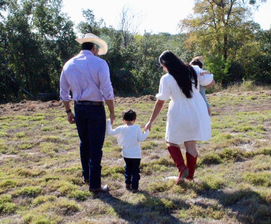 A Texas family walking together, representing working families getting ahead